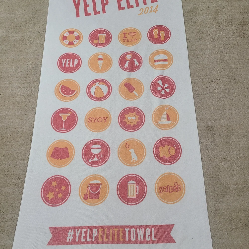 Elite 2014 White Beach Towel with Red and Yellow Icons
